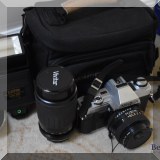 E21. Minolta film camera with Sunpack flash and Vivitar lens. 